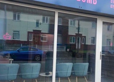 DMD Aesthetics venue entrance with modern glass windows in Eccles, England, GB.