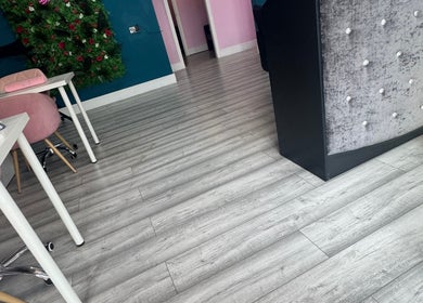 Chic interior of DMD Aesthetics, Eccles, England, with elegant decor and cozy seating.