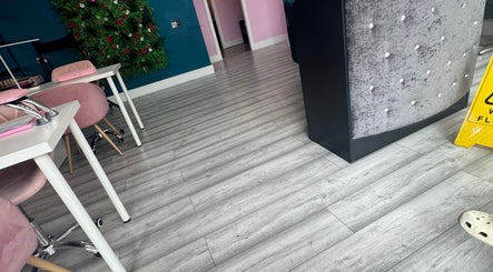 Chic interior of DMD Aesthetics, Eccles, England, with elegant decor and cozy seating.
