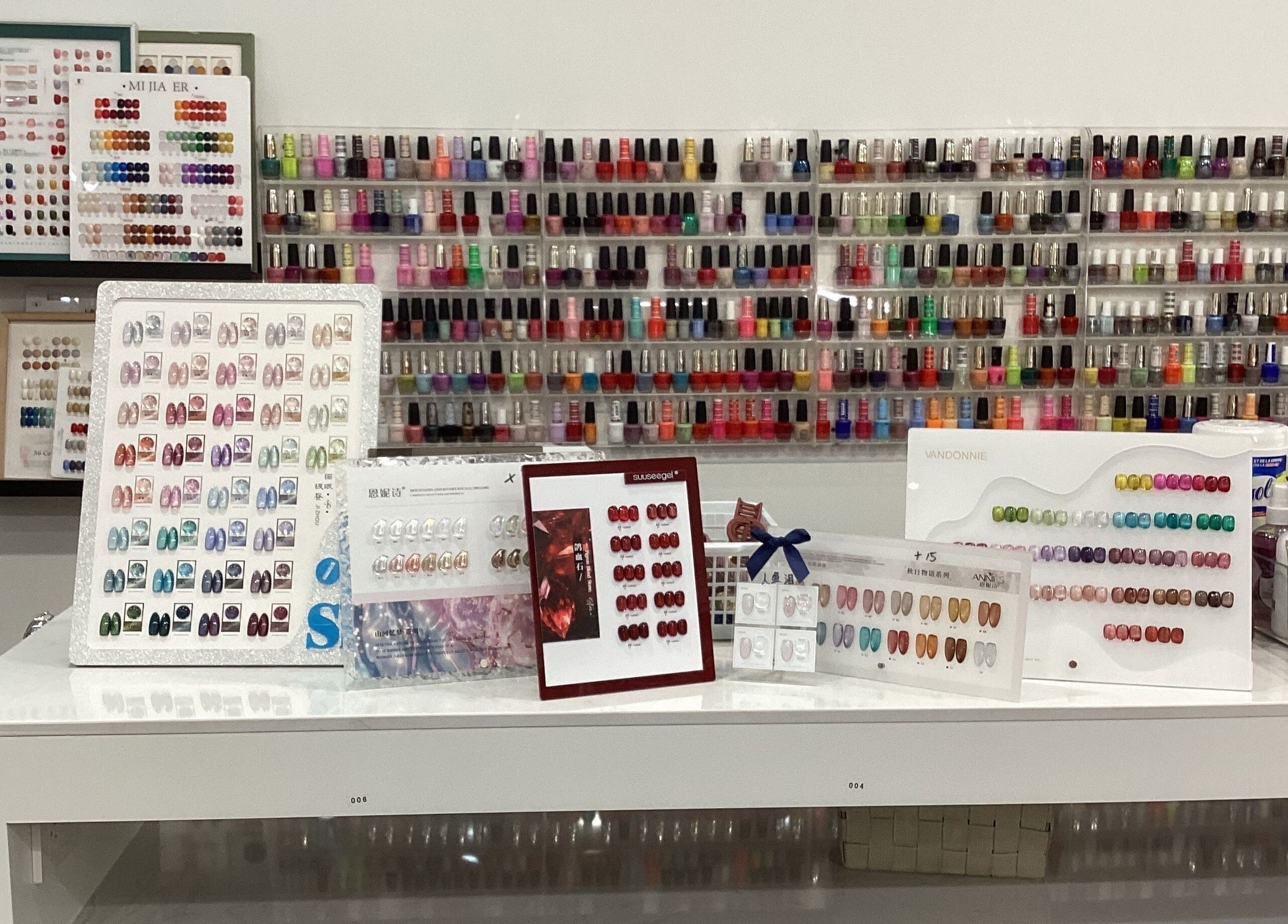 Diverse nail polish collection on display at Love Nail Spa, Whitby, Ontario, CA, showcasing vibrant colors.