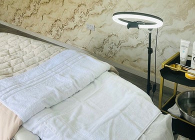 Inviting spa room at Glow&co. Skin Lab, Stockton-on-tees, England, GB, featuring a cozy treatment bed.
