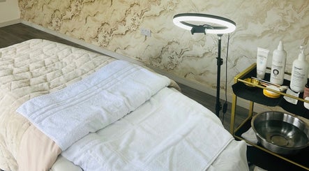 Inviting spa room at Glow&co. Skin Lab, Stockton-on-tees, England, GB, featuring a cozy treatment bed.