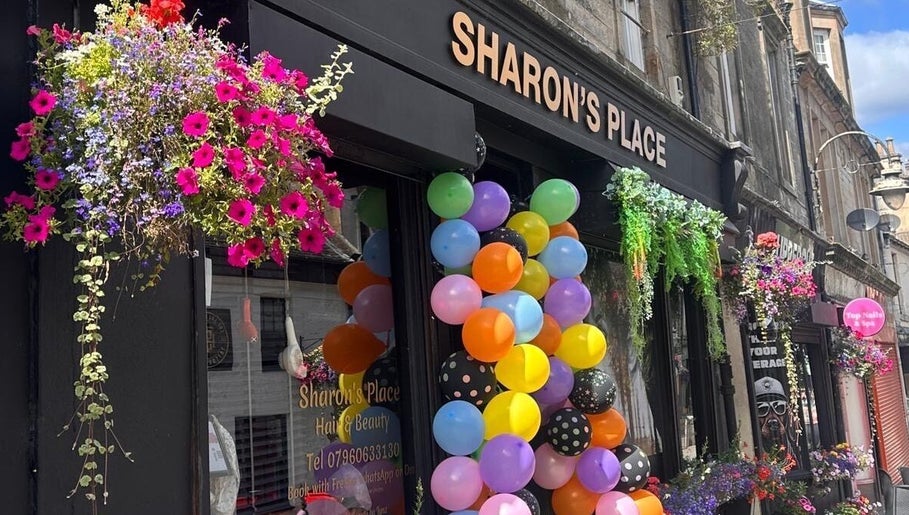Colorful balloons and flowers decorate LMJ Hair & Makeup Designs in Kilsyth, Scotland, GB.