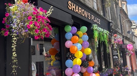 Colorful balloons and flowers decorate LMJ Hair & Makeup Designs in Kilsyth, Scotland, GB.