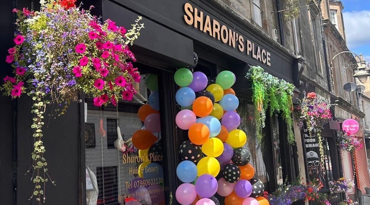 Colorful balloons and flowers decorate LMJ Hair & Makeup Designs in Kilsyth, Scotland, GB.