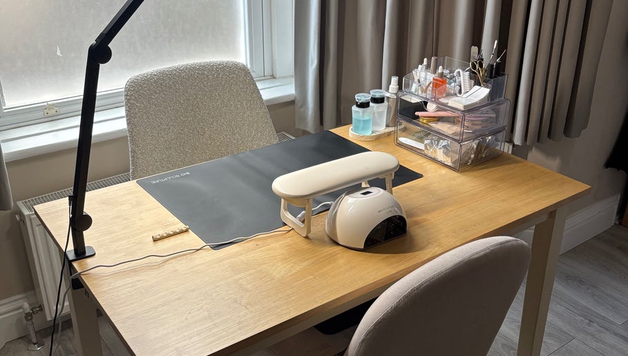 Nail care workspace at By Amelia Ldn, London, England, GB, featuring organized tools and a nail lamp.