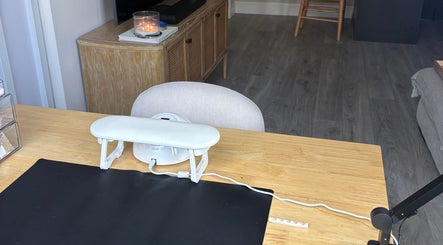 Cozy desk space at By Amelia Ldn, London, England. Features modern decor and a relaxing ambiance.