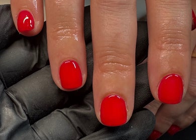 Red manicure by By Amelia Ldn, showcasing vibrant nails in London, England, GB.