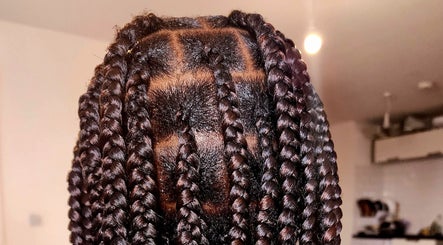 Intricate braided hairstyle at Beauty by Rosecrown, Manchester, England, GB showcases expert styling.