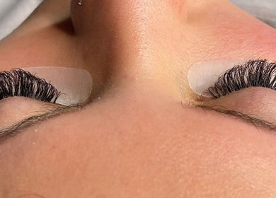 Eyelash extension service at TG Beauty, London, England, GB, showcasing detailed lash application.