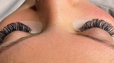 Eyelash extension service at TG Beauty, London, England, GB, showcasing detailed lash application.
