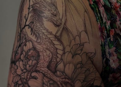 Detailed dragon tattoo artistry at Slyther INK in Spokane, Washington, US.