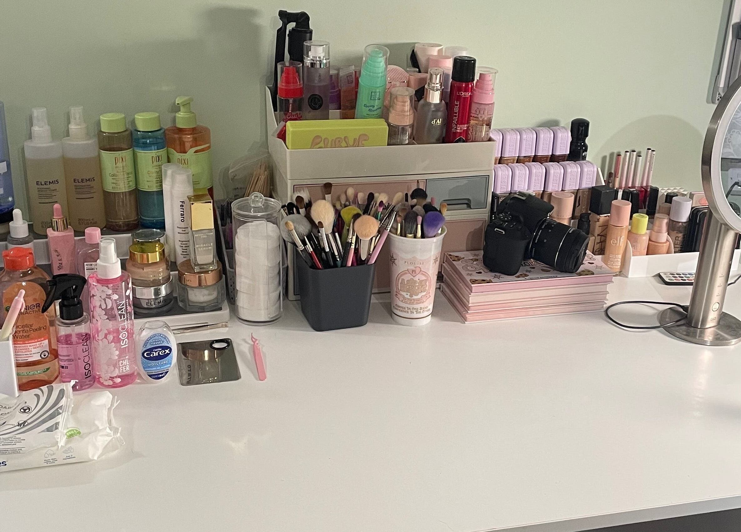 Makeup station at karlyb.mua.liverpool in Liverpool, England, GB featuring brushes, products, and mirror.