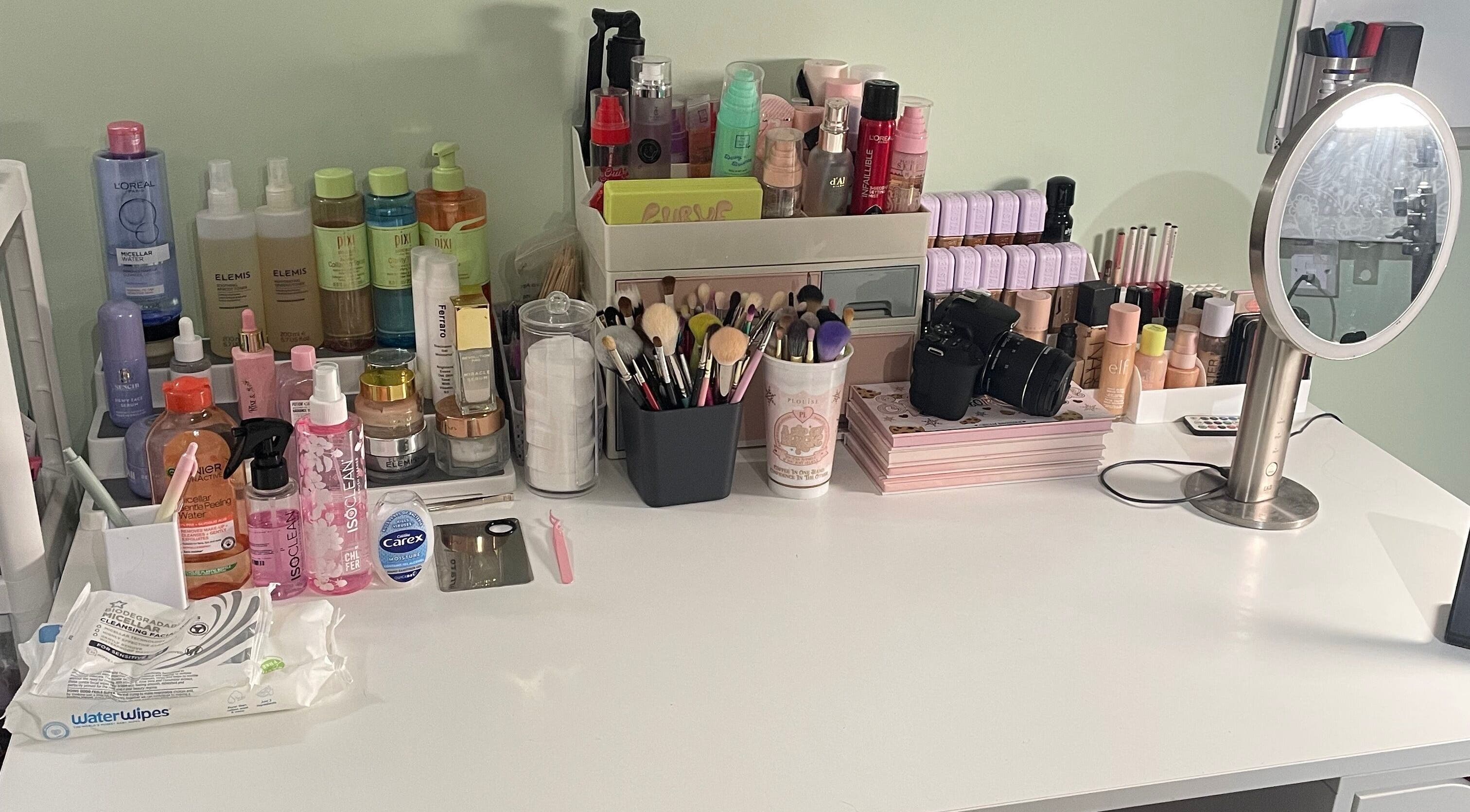 Makeup station at karlyb.mua.liverpool in Liverpool, England, GB featuring brushes, products, and mirror.