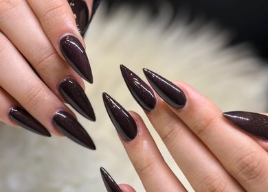 Elegant pointy ebony nails at Pasea Nail & Spa in Bothell, Washington, US showcasing precision nail artistry.