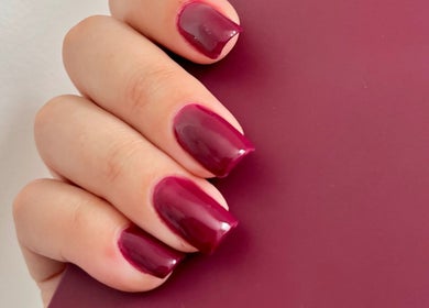 Elegant crimson manicure at TTS Nails, Norwich, England, GB, showcasing stylish beauty and wellness.