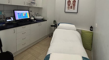 Tranquil massage room at WA WA Professional Massage Inverell, featuring a cozy treatment bed. Location: Inverell, New South Wales, AU.