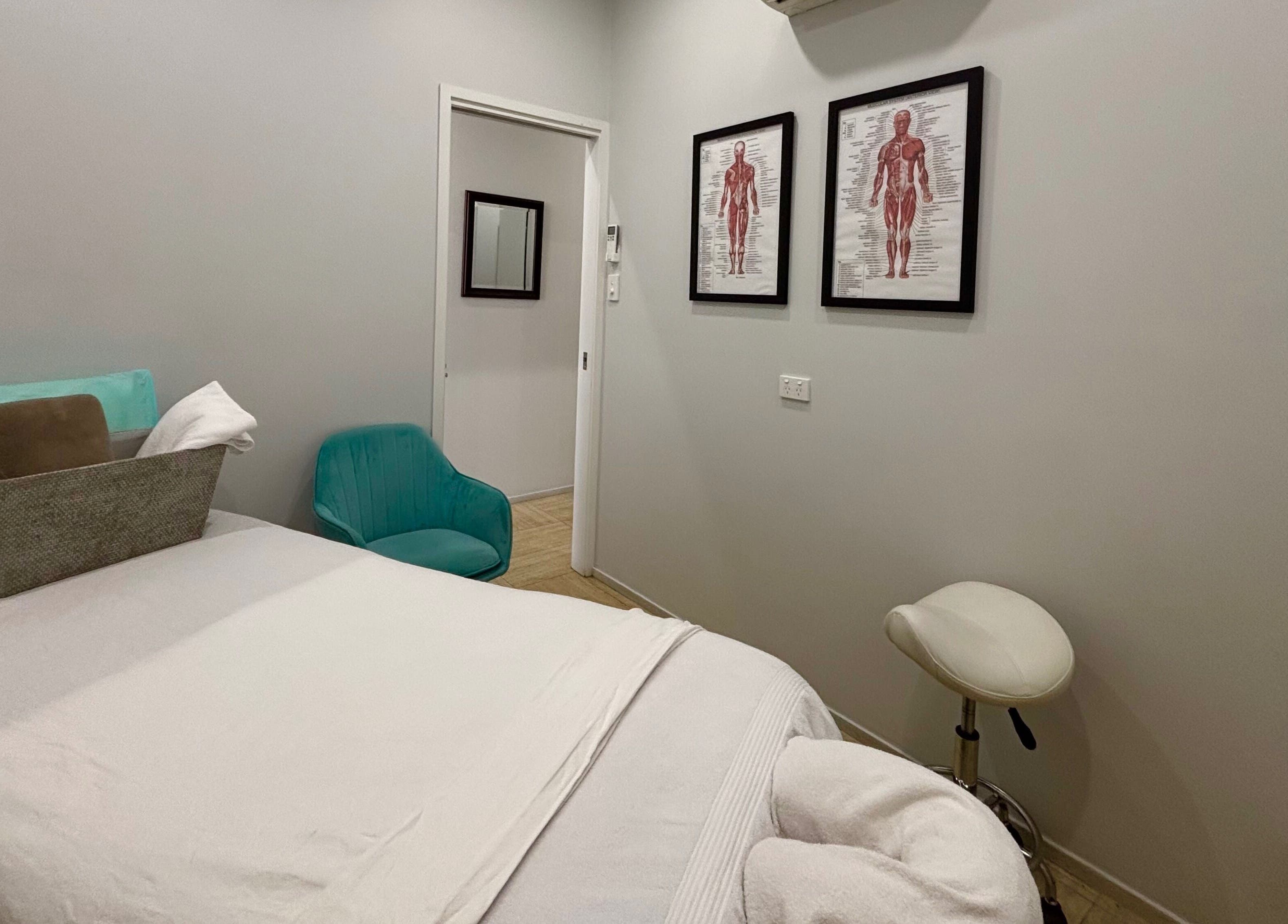 Relaxing massage room at WA WA Professional Massage Inverell, Inverell, New South Wales, AU with cozy bedding.