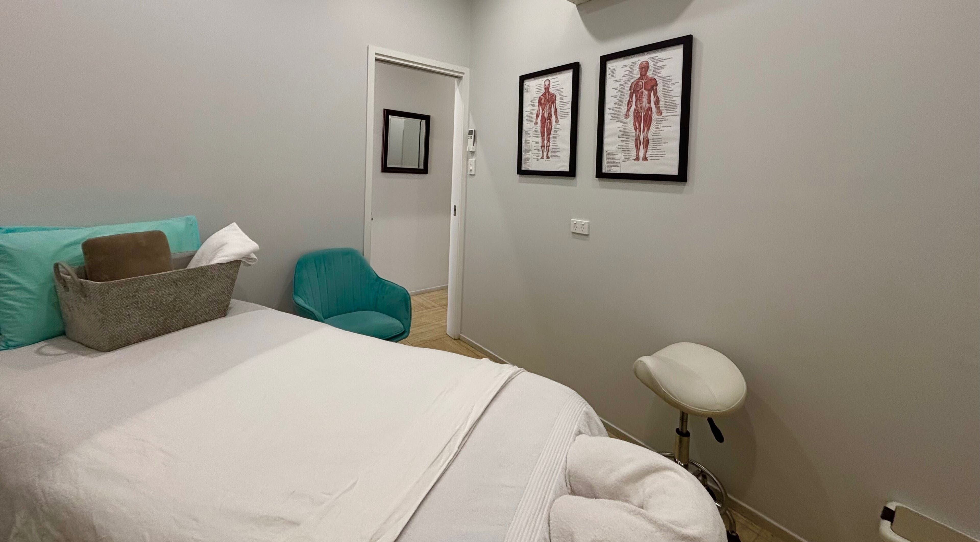 Relaxing massage room at WA WA Professional Massage Inverell, Inverell, New South Wales, AU with cozy bedding.
