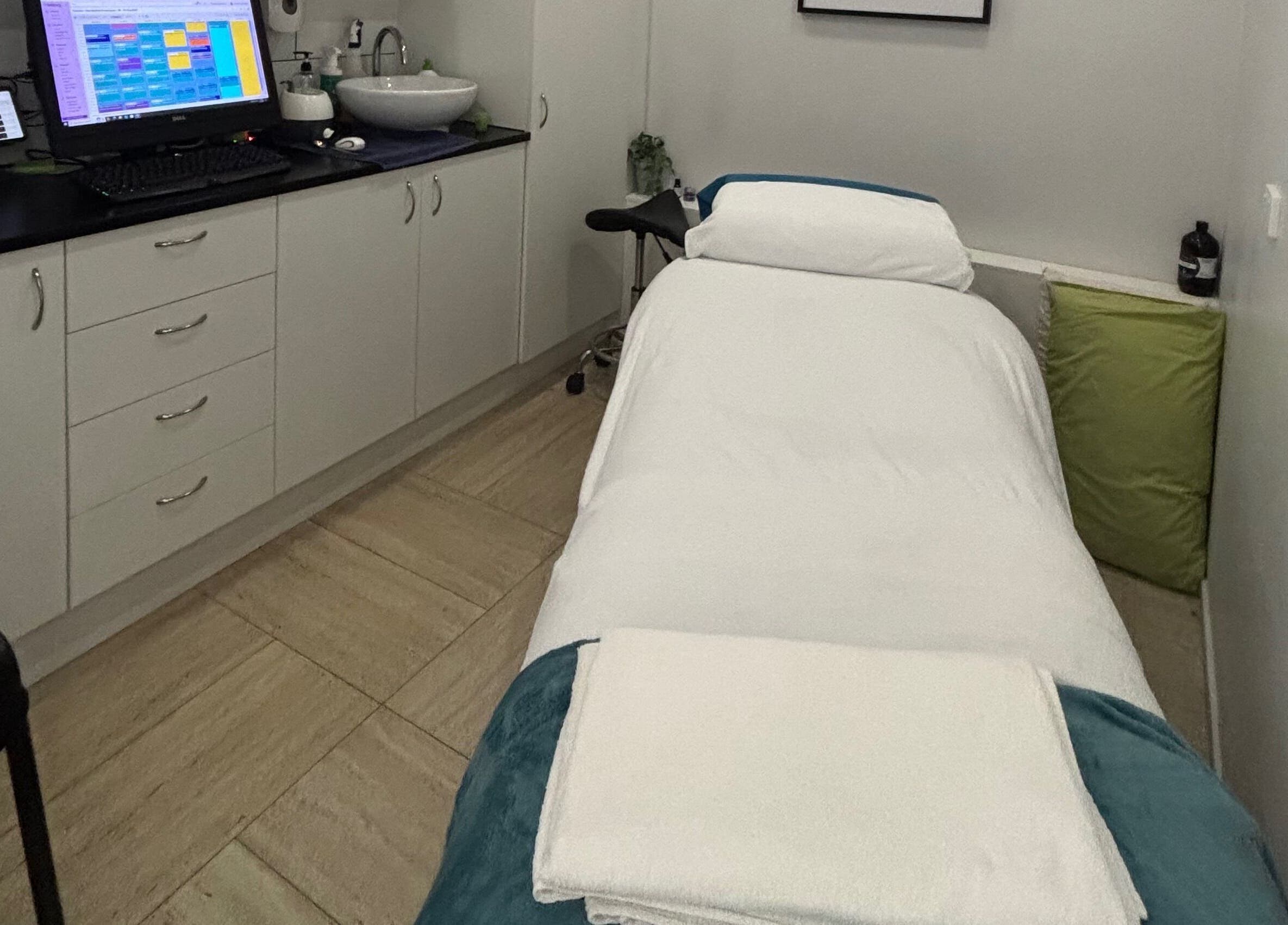 Tranquil massage room at WA WA Professional Massage Inverell, New South Wales, AU, featuring clean decor.