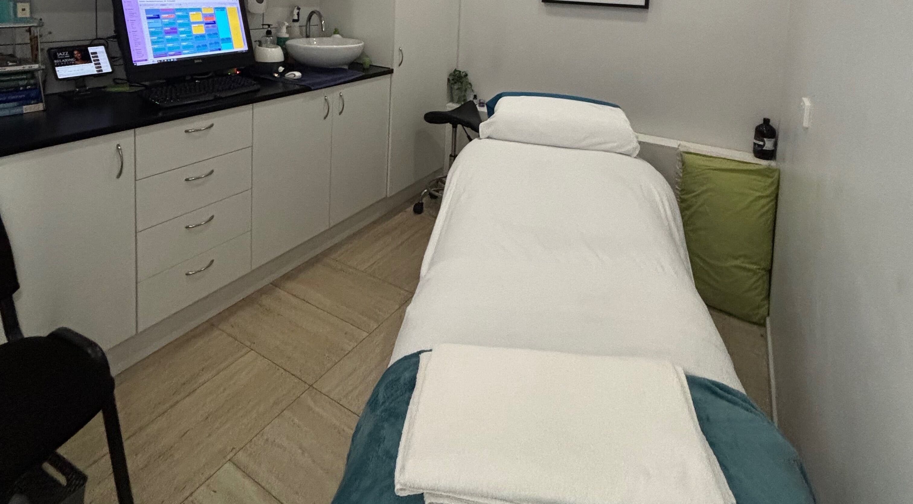 Tranquil massage room at WA WA Professional Massage Inverell, New South Wales, AU, featuring clean decor.