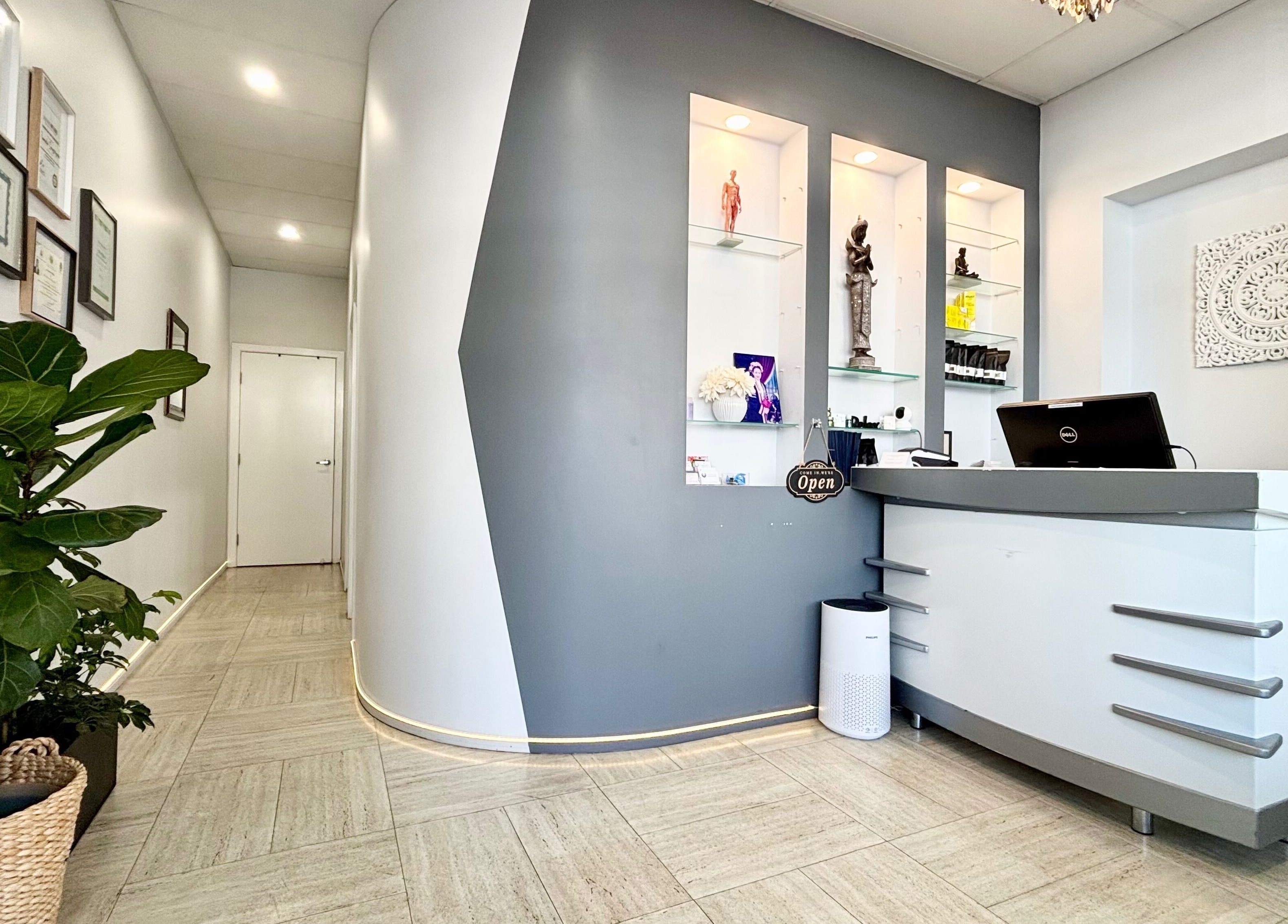 Reception area of WA WA Professional Massage Inverell, featuring modern decor and calming lighting in Inverell, New South Wales, AU.