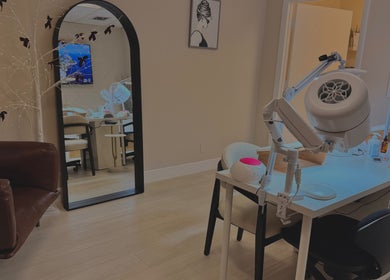 Elegant interior of Sasha.B.B.B Nail Studio in Boca Raton, Florida, US showcasing stylish decor and nail stations.