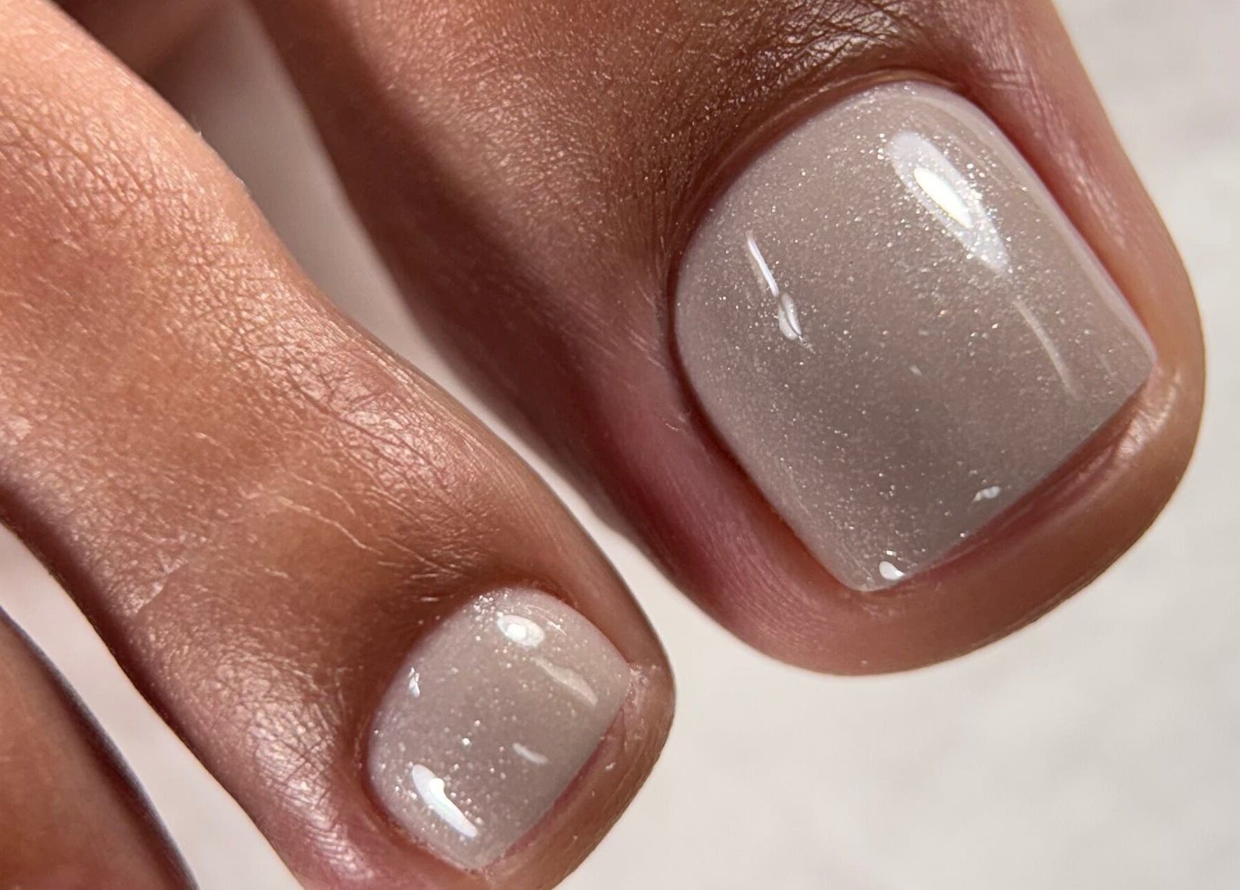Close-up of a polished toenail with a glossy finish at Sasha.B.B.B Nail Studio, Boca Raton, Florida, US.