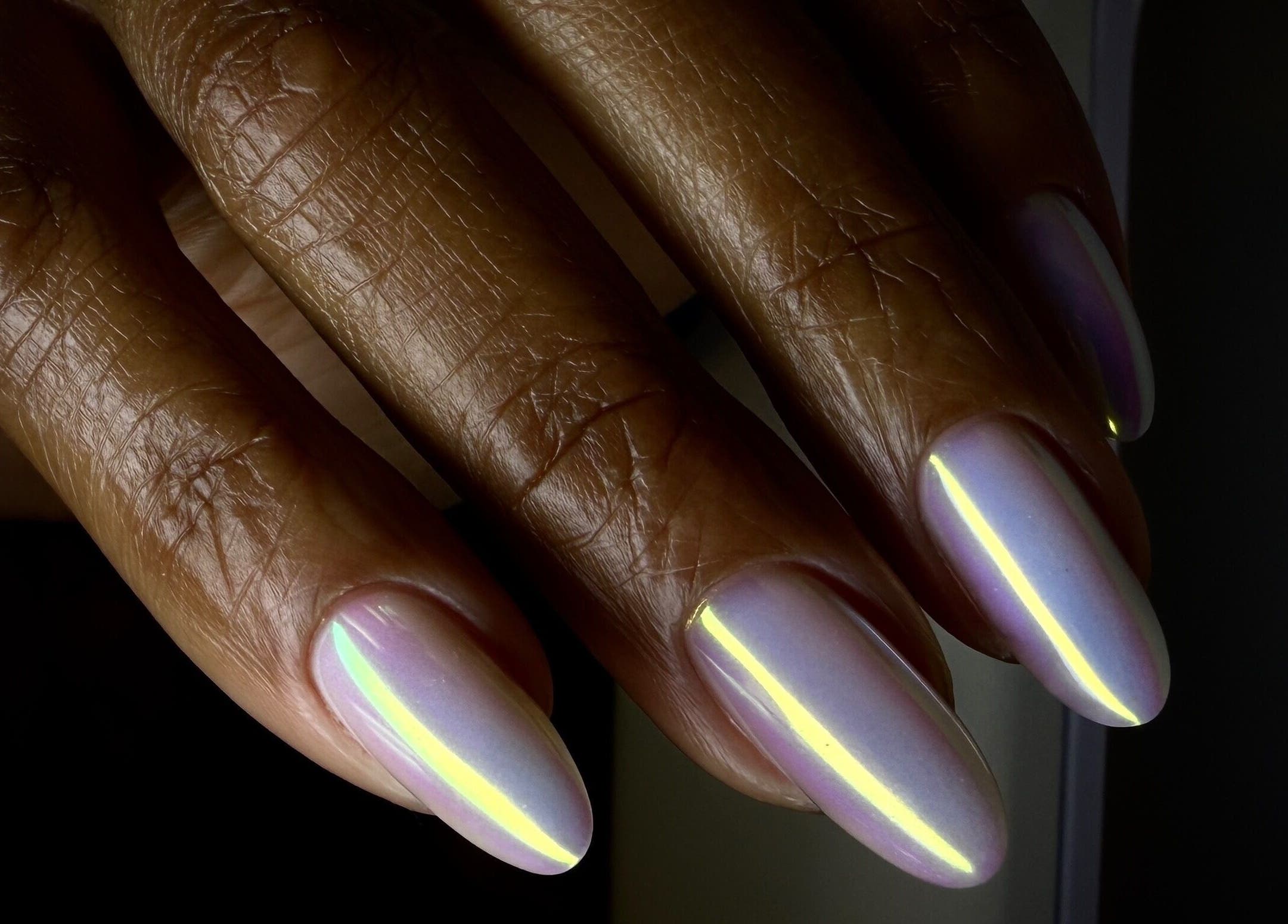 Glowing nails crafted at Sasha.B.B.B Nail Studio, located in Boca Raton, Florida, US, showcasing a luminous manicure.