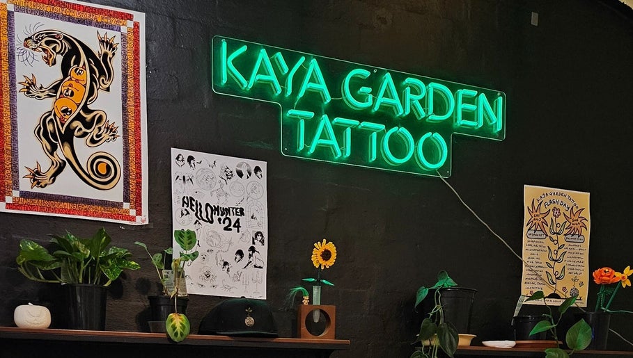Kaya Garden Tattoo Haymarket neon sign with vibrant art and plants in Haymarket, NSW, AU.