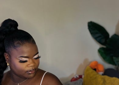 Elegant makeup showcased at Allure Beaute’, St. Johns, AG, highlighting intricate eye detail.