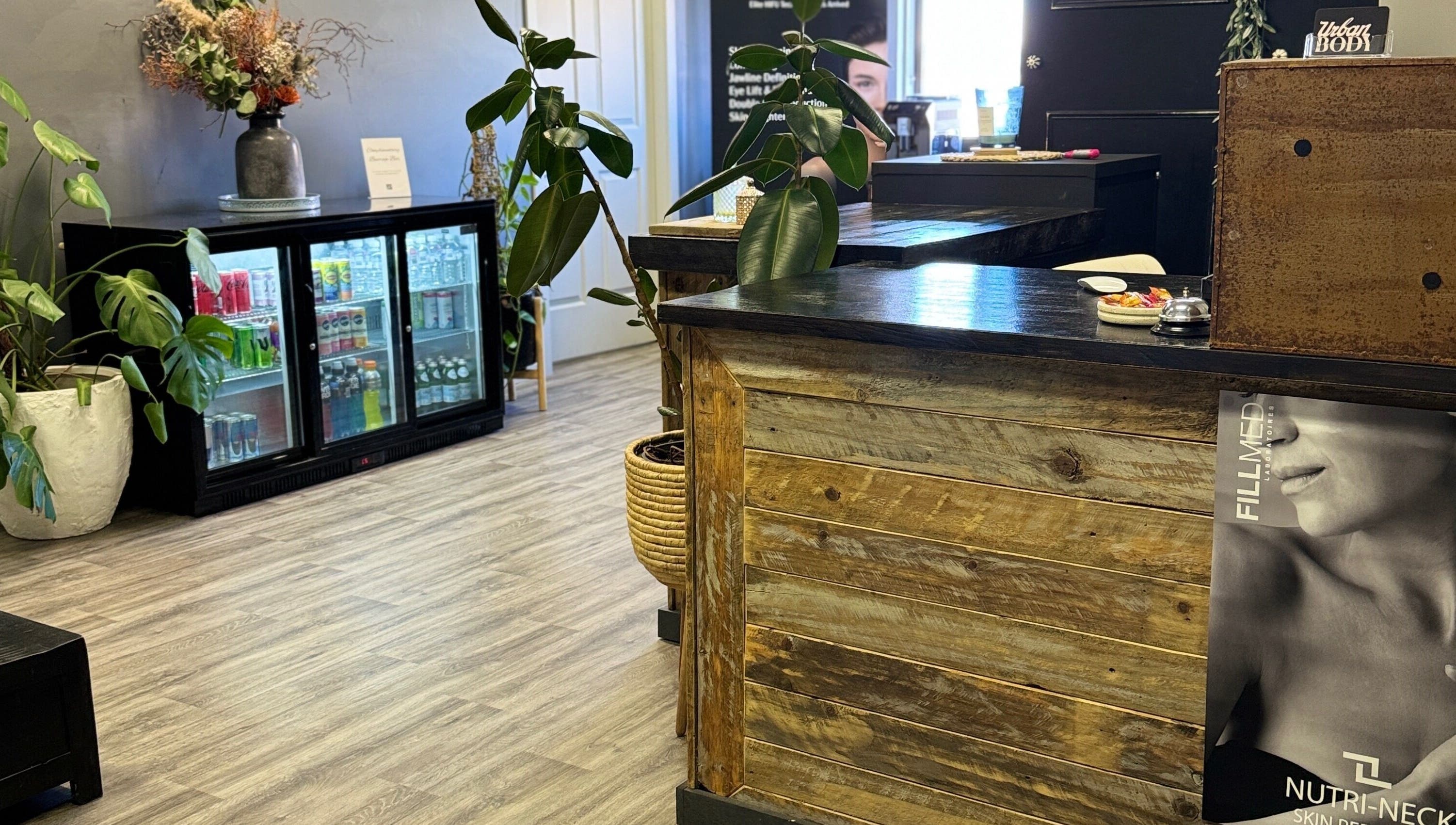 Chic reception at Urban Body, Bathurst, showcasing natural decor and a cozy ambiance.