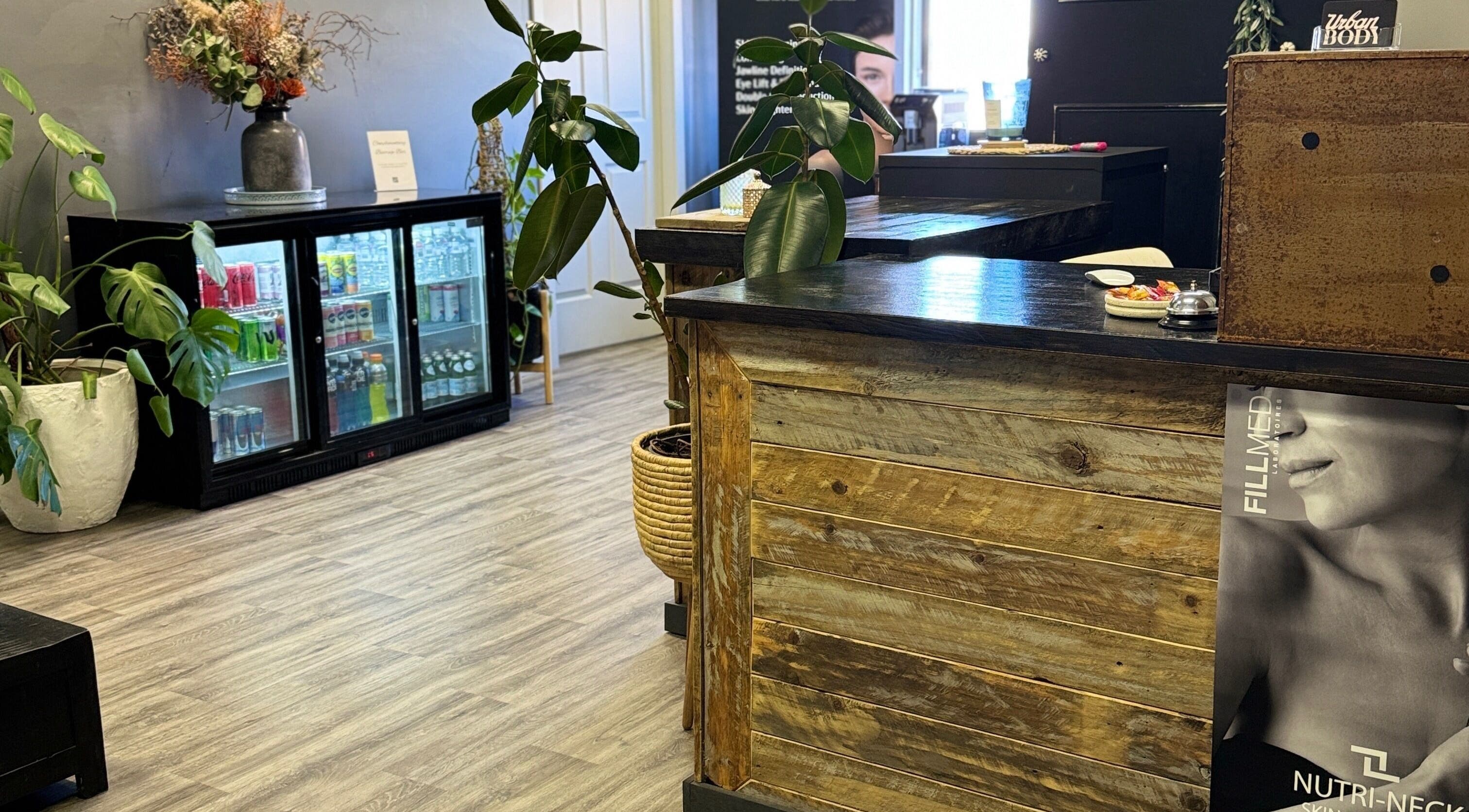 Chic reception at Urban Body, Bathurst, showcasing natural decor and a cozy ambiance.