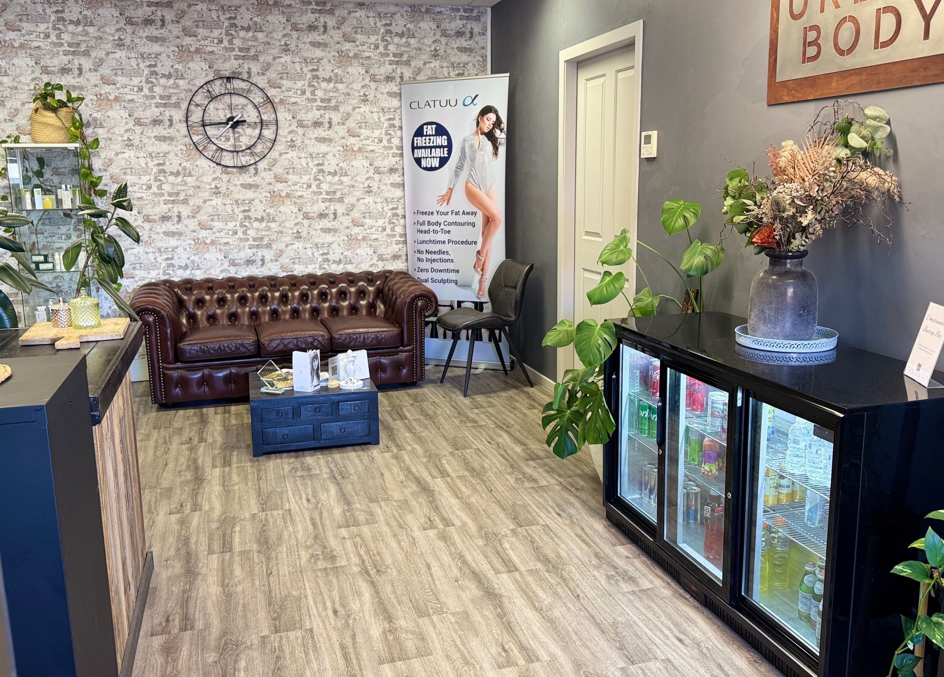 Urban Body's cozy lounge in Bathurst, New South Wales, AU, featuring stylish decor and a leather sofa.