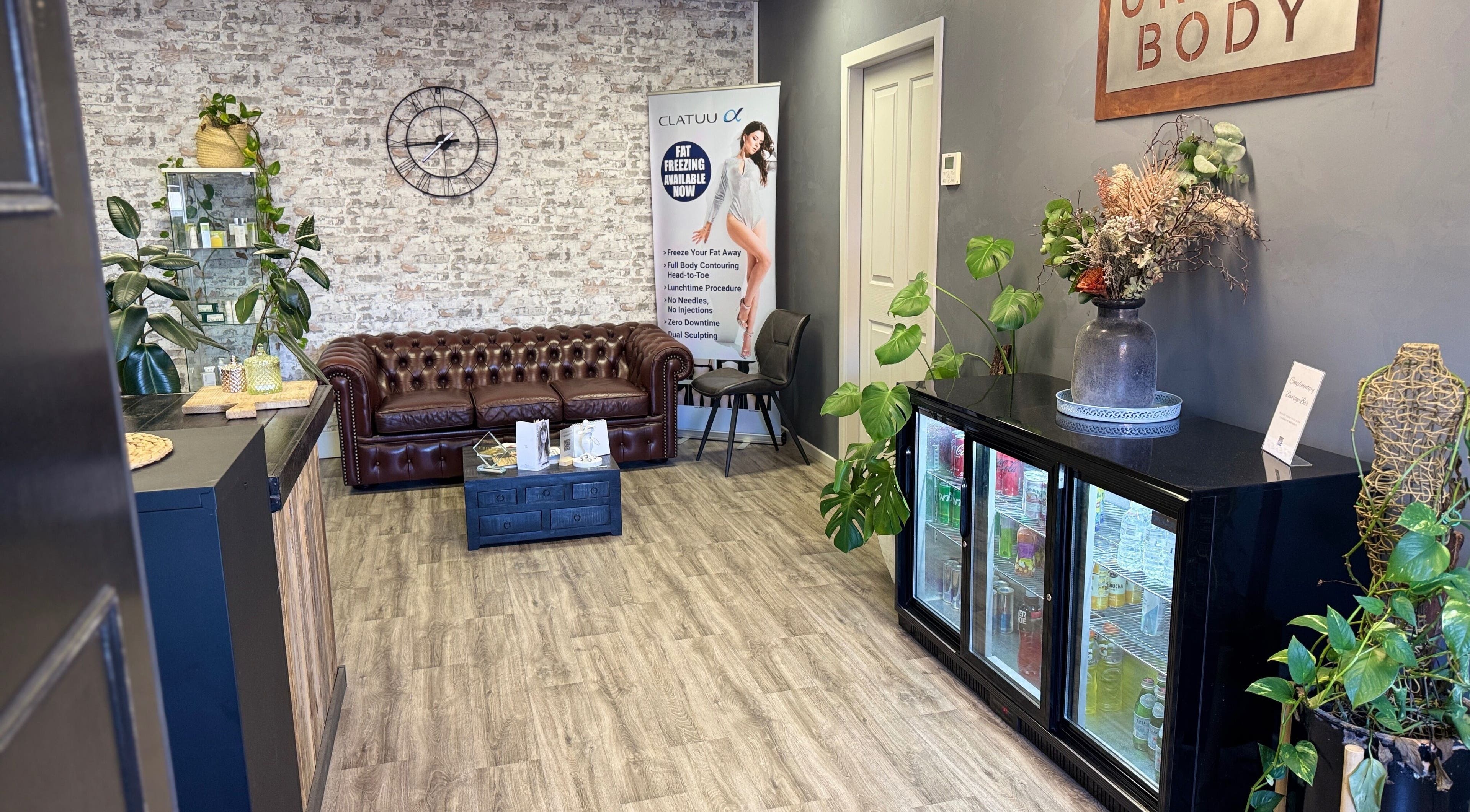 Urban Body's cozy lounge in Bathurst, New South Wales, AU, featuring stylish decor and a leather sofa.