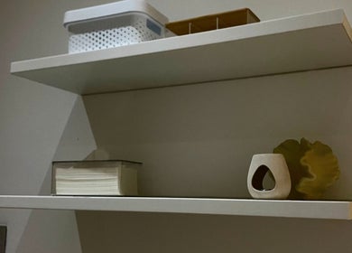 Elegant shelves with decor at Bella Glow Studio, Windhoek, Khomas Region, NA, showcasing modern style.