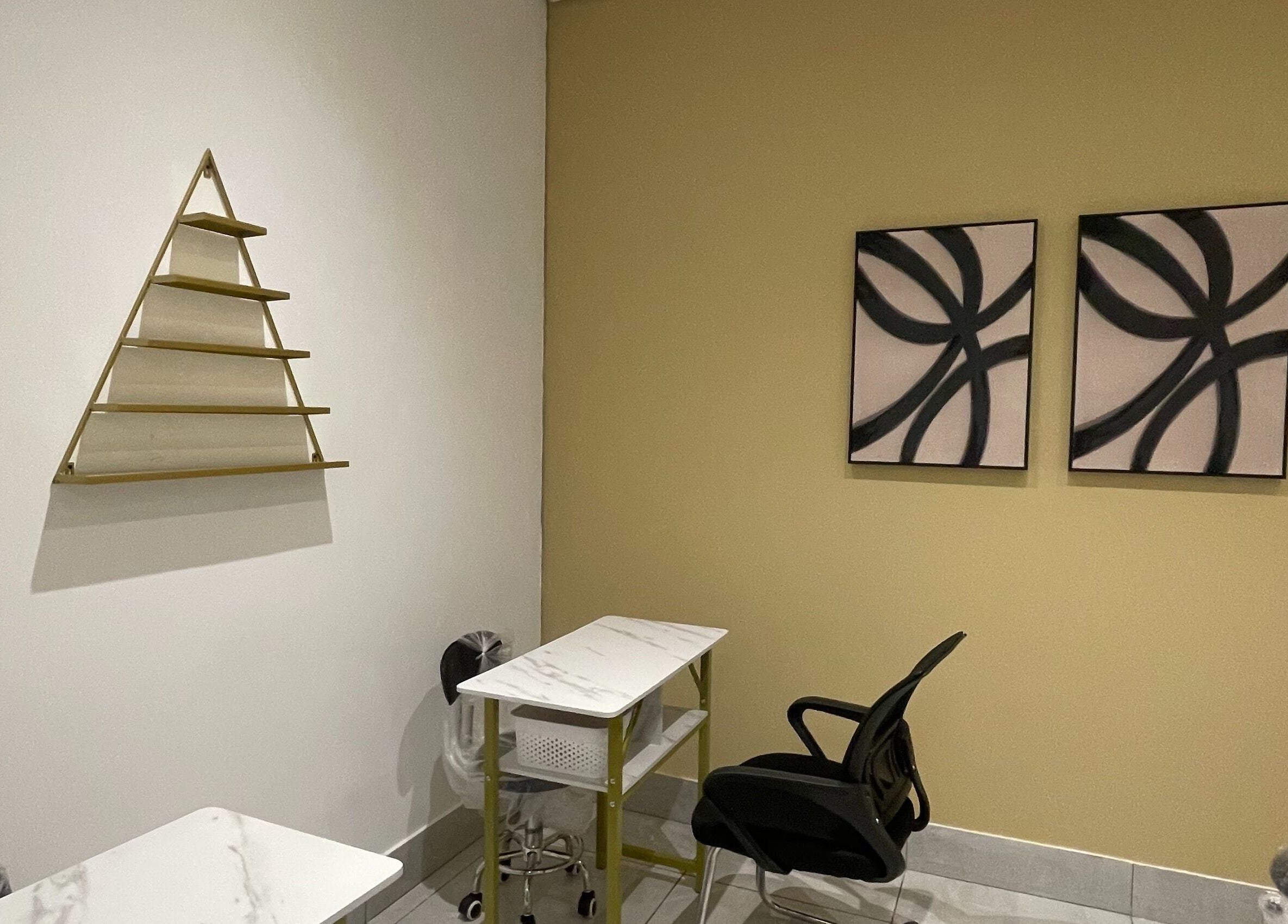 Modern seating area at Bella Glow Studio, Windhoek, Khomas Region, NA with elegant decor and minimalist design.