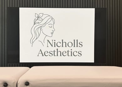 Nicholls Aesthetics logo on display wall at Burton-on-trent, England, GB, showcasing elegant salon ambiance.