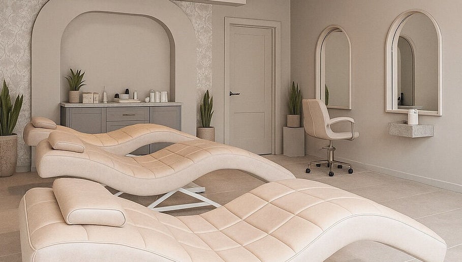 Elegant treatment room at 23 Aesthetic Studio, Southend-on-sea, England featuring plush chairs and mirrors.