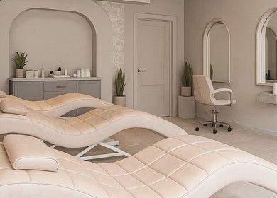 Elegant treatment room at 23 Aesthetic Studio, Southend-on-sea, England featuring plush chairs and mirrors.