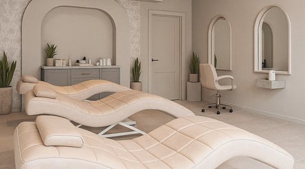 Elegant treatment room at 23 Aesthetic Studio, Southend-on-sea, England featuring plush chairs and mirrors.