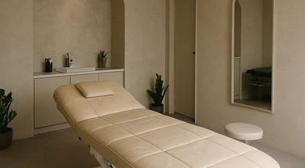 Relaxing treatment room at 23 Aesthetic Studio in Southend-on-Sea, England, GB, with calming neutral tones.