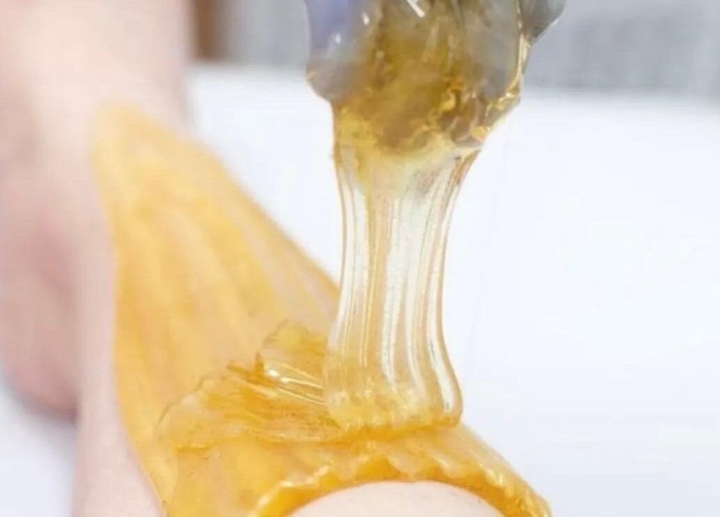 Sugaring treatment in progress at SugarViz, Singapore, SG, highlighting gentle hair removal.