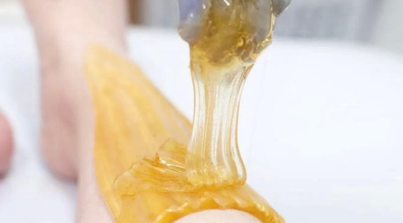 Sugaring treatment in progress at SugarViz, Singapore, SG, highlighting gentle hair removal.