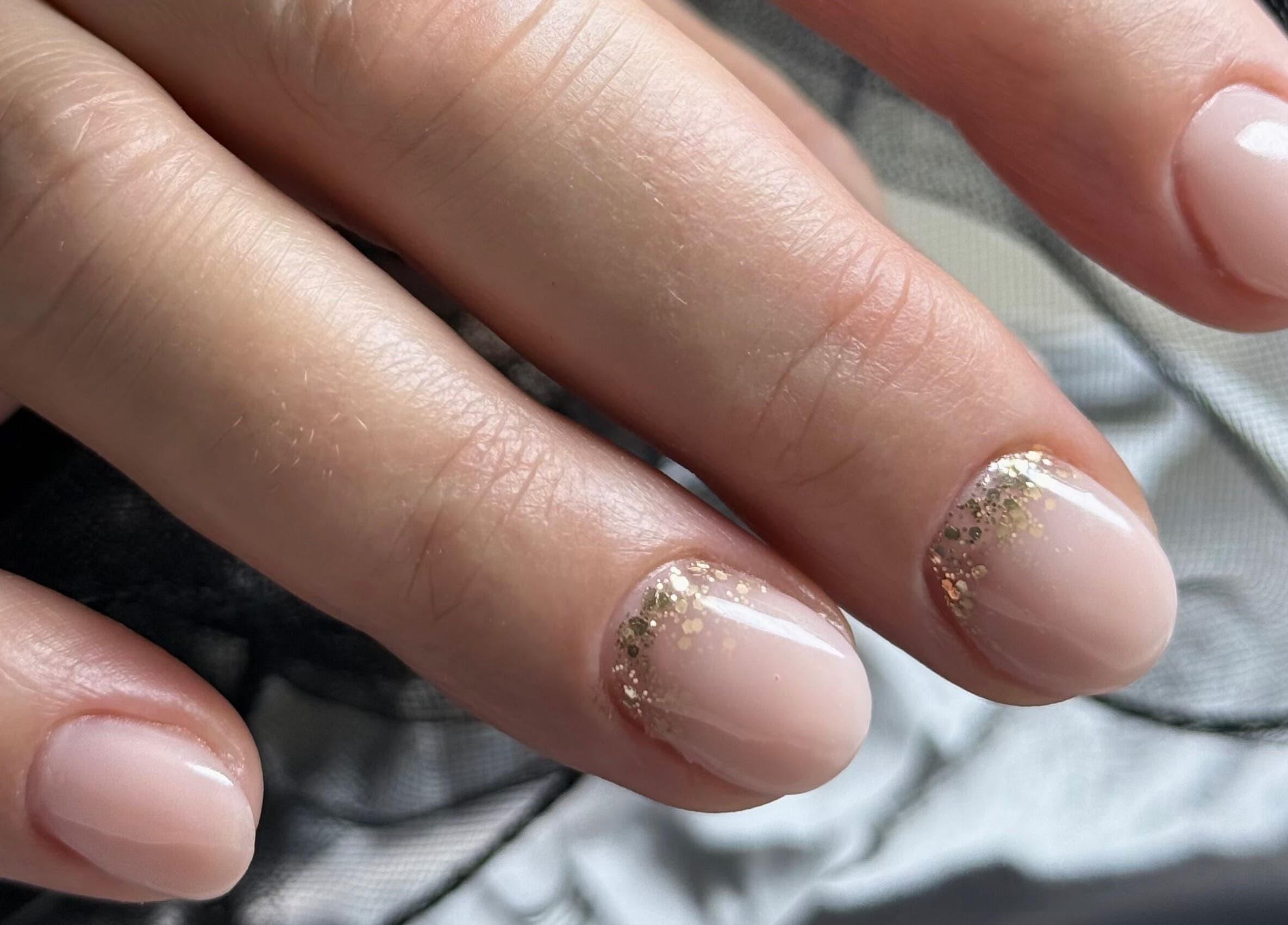 Elegant nude nails with glitter at Daria Art & Grace Nail Studio, Eindhoven, Noord-brabant, NL.
