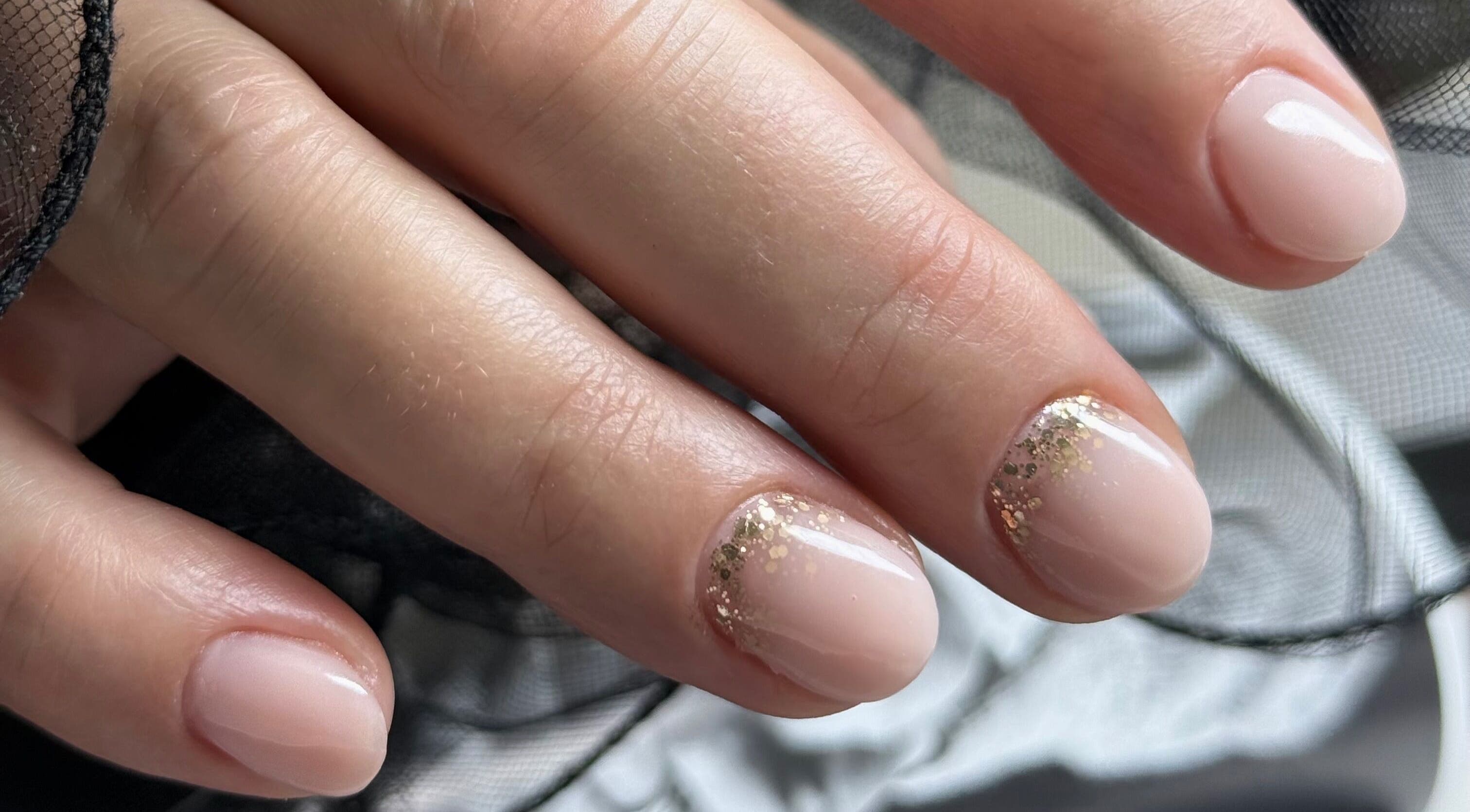 Elegant nude nails with glitter at Daria Art & Grace Nail Studio, Eindhoven, Noord-brabant, NL.