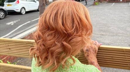 Vibrant copper curls styled at Hair By Fran Barrett in Ripon, England, GB, showcasing expert hair artistry.