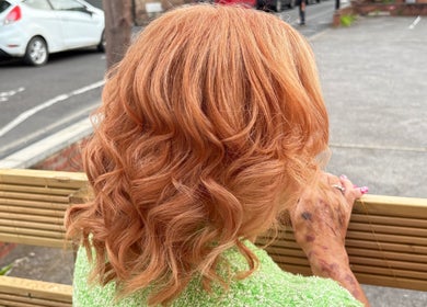 Curly golden hair styled at Hair By Fran Barrett, Ripon, England, GB. Vibrant and elegant look.