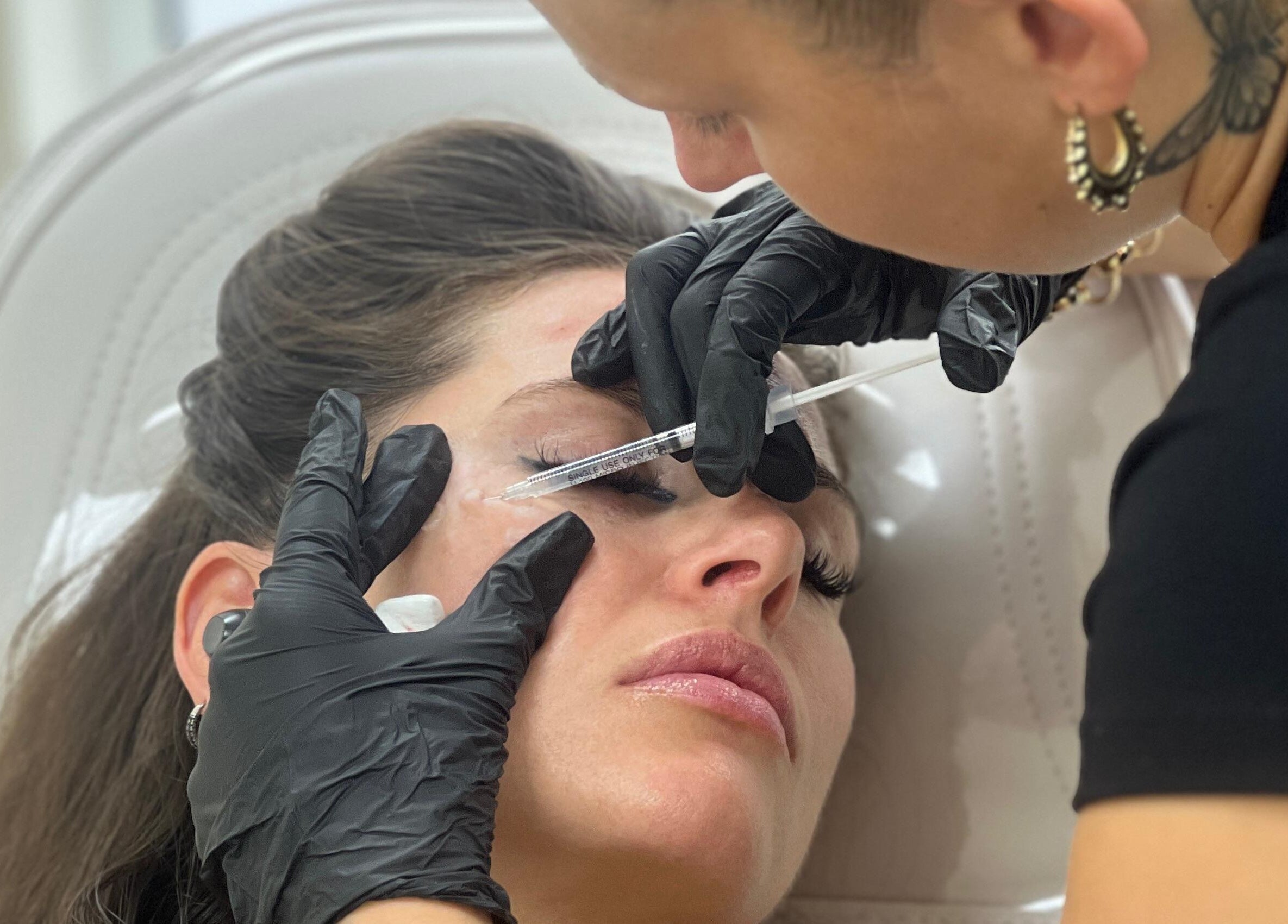 Aesthetic professional performing precise enhancement at Angel Aesthetics, Lincoln, England, GB.