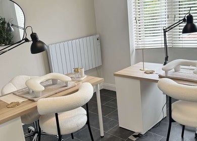 Modern nail stations at Nailsbyxanth, Nantwich, England, GB, featuring sleek design and comfortable chairs.